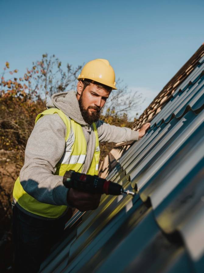 man-working-roof-with-drill